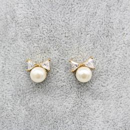 Stud Earrings The 2023 Fashion Imitation Pearl Bow And Contracted