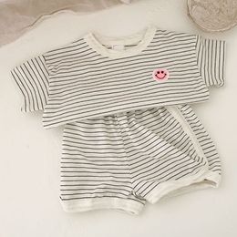 Clothing Sets Summer boys and girls cute smiling face shortsleeved suit childrens striped pullover top shorts casual sports twopiece set 230331