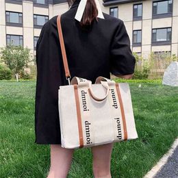 Purses super fire same casual letter canvas stripe portable one shoulder diagonal straddle Tote women's bag new style
