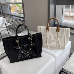 70% Off Purses on sale 2022 New Small Fragrant Canvas with Leather Hand Chain Pearl Beach Mommy One Shoulder Tote Bag
