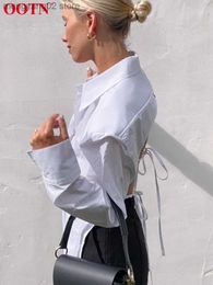 Women's Blouses Shirts OOTN Sexy Streetwear White Hollow Out Blouse Shirt Summer Backless Lace Up Top 2022 Fashion Loose Blouses Turn Down Collar Shirt T230508