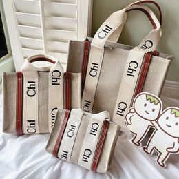 Lüks Woody tote çanta tasarımcısı Bayan erkek kanvas keten büyük kılıf çanta moda alışveriş orta keten Plaj seyahat çantaları Debriyaj Crossbody Omuz çalışması naylon torba