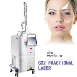 CO2 Fractional laser machine Lighten spots and acne marks Remove stretch marks Pink and tender vulva Vagina tightening device skin resurfacing