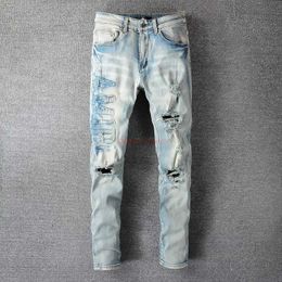 Designer Clothing Amires Jeans Denim Pants Amies 697 High Street Broken Letter Sticker Cloth Used Wash Water Elastic Fit Ins Blue Jeans for Men Distressed Ripped Skin