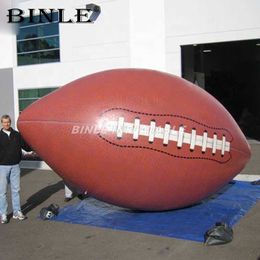 Customised outdoor fun giant inflatable rugby ball inflatable football replica model for sports game decoration