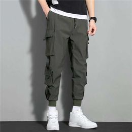 Pantaloni da uomo 2023 Primavera casual estate abbigliamento sportivo tattico pantaloni cargo harem da jogging tute da uomo taglie forti 3xl P230529