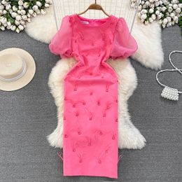 Luxury and luxurious elegant bubble sleeved round neck waistband show slim medium length tassel wrap buttocks dress