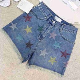 Женские джинсы дизайнер 23 нового стиля горячих буровых пентаграммов Raw Edge Denim Shorts Высококачественная одежда Yu5t