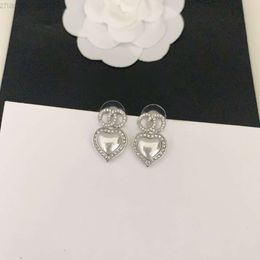 Designer Channel Xiaoxiangs Personalized Diamond Inlaid Heart Silver Earrings for Women with a Sense of Luxury Small and Exquisite Fashionable and Versatile for So