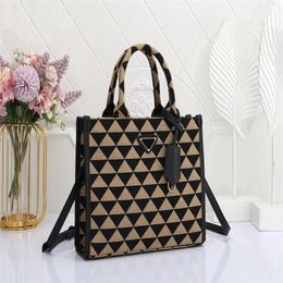 Classic triangle-shaped Tote bag with a single shoulder strap strap and detachable leather key chain302N