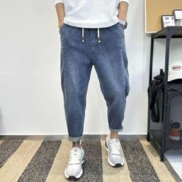 High-end light luxury blue gray jeans men's new radish pants elastic slim feet nine-point pants 17