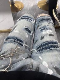 2023 Spring and autumn new drilled holes splash-inked patch jeans men American high street trend 100 matching long pants men 39