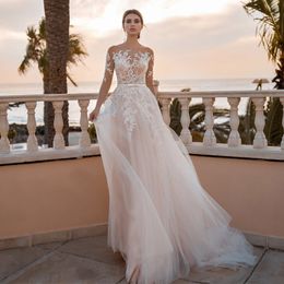 Jewel Illusion Wedding Dresses 2023 Bride Covered Button Sweep Train Stylish Lace Applique Mordern Tulle Long Sleeve Hollow