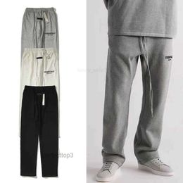 Pantaloni da uomo 2023 Nuovi e da donna High Street Brand Essentialsweatpant Stagione 8 Doppia linea Tubo dritto Allentato Nero Floccaggio Pr