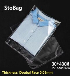 StoBag 100pcs 3040cm Transparent Self Adhesive Plastic OPP Resealable Poly Cellophane Clothing Bags Clear Packing Gift Bag Y12024753514