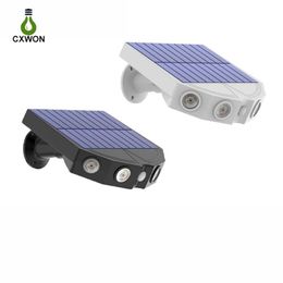 2pcs pack Outdoor Solar lamps Imitation Monitoring Design 4LED Street Light Motion Sensor Waterproof Wall Lamp for Garden Courtyar306k
