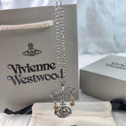 Designer Viviene Westwoods New Viviennewestwood Empress Dowager Xi's 3d Saturn Bow Bell Necklace Light Luxury Fashion Planet Necklace High Edition