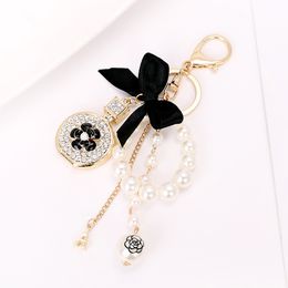 Wholesale 20pcs Keychains Bow-Knot Imitation Pearl Perfume Crystal Bottle Iron Tower Chain Car Key Ring Bag Charms Accessories Girl Keyring Pendant Gift 2023