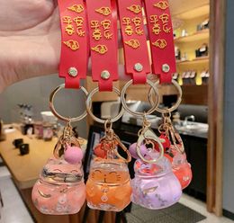 Creative Fashion Lucky Cat Transparent Floating Bottle Keychain Female Cute Acrylic Doll Keychain Car Pendant Jewelry Gift G10199112547