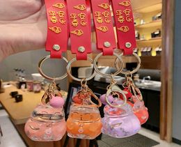 Creative Fashion Lucky Cat Transparent Floating Bottle Keychain Female Cute Acrylic Doll Keychain Car Pendant Jewellery Gift G10199568826