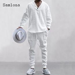 Mens Tracksuits casual knitted twopiece set winter fashion irregular top sweater and pure white sports pants 231213