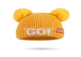 Autunno e inverno Cappello lavorato a maglia per bambini 039 2020 Nuova lettera calda Cappello di lana lavorato a maglia per bambini 039 Doppio berretto di lana7181007