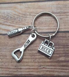 whole 12pcslot Beer Bottle Opener Key chain beer opener charm pendant key ring Personalised Key Chain Truly a Man039s Gift8124984