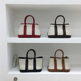 Top original wholesale Hremmss Party Garden tote bags online shop This seasons 2023 new early autumn contrasting canvas bag feels like handheld With Real Logo