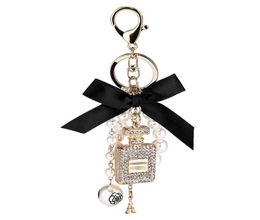 Creative Handmade Diy Diamond Perfume Bottle Accessories Alloy Bow Pearl Luxury Keychain Purses Charm Pendant YS0686523261