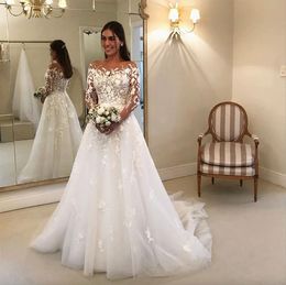 Long Sleeves Graceful Wedding Dresses Sheer Bateau Neck Lace Covered Buttons Bridal Gowns Sweep Train Tulle Robe De Marie