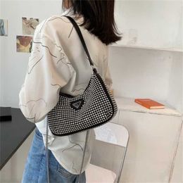 2024 New Designer women's crossbody shoulder Diamond inlaid red armpit Korean chain messenger shiny rivet bag