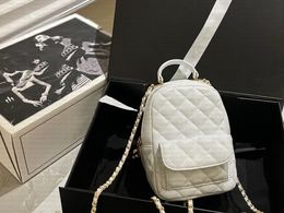 Fashionable diamond patterned genuine leather women backpack classic metal circular loop buckle zipper bag luxury designer caviar bag