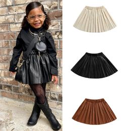 Skirts born Kid Girl Leather Pleated Skirts Elastic Waist Solid Color Knee Length Elegant Half Skirt 231219