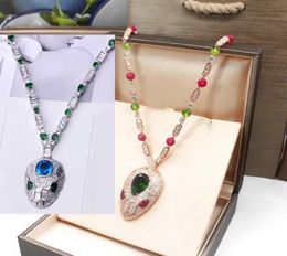 Hot Sale Fashion Lady Women Brass 18K Gold Inlay Color Gemstone Necklaces With Full Diamond Red/Blue Eyes Zircon Head Pendant7868301