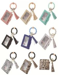 Stock Fashion PU Leather Bracelet Wallet Keychain Tassels Bangle Key Ring Holder Card Bag Silicone Beaded Wristlet Keychains Handb6789735