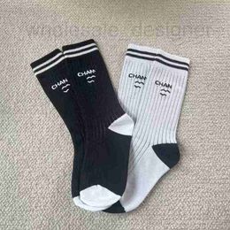 Athletic Socks Designer fashionable minimalist letter stripes, black and white vertical stripes pile up cotton socks in the middle tube women