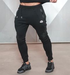 New Gold Medal Fitness Casual Elastic Pants Stretch Cotton Men 039S Pants Body Engineers Jogger Bodybuilding Pants1767198