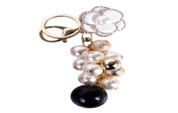 Keychains Creative Flower Pearl Keychain Women Bag Zipper Charms Crystal Rhinestone Key Chain Ring Fashion Holder Car Keyrings Tri9885797