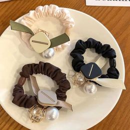 Japanese and Korean style high-end pearl large intestine hair loop simple temperament high elasticity headband hair accessories bow knot fabric hair rope