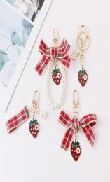 Keychains Lovely Red Plaid Ribbon Strawberry Keychain Women Girl Jewellery Simulated Fruit Bowknot Bag Car Key Holder Keyring Birthd5451953