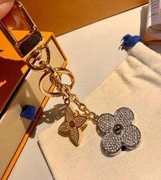 Top Designer Key Rings Luxury Monogram Logos Blooming Flower Strass Keychain M64265 Alloy Circle Car Key Ring Bag Charm Keychain C9582116