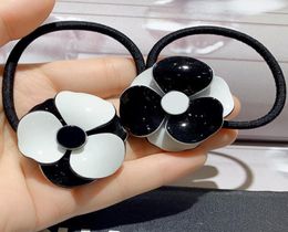 Fashion black and white acrylic flower hair rope rubber bands hairpins popular headwear jewelry in European and American countries9653250