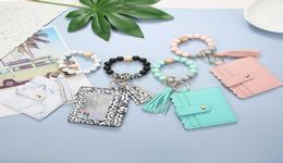 Handmade Jewelry Whole Silicone Bead Bracelet Card Holder Wooden Bead Wrist Keychain Pendant AntiLost Tassel Bracelet Key Rin4760851