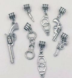 Necklace pendant 100PCS lot Pistolrevolver bullets Handcuffs Charms Pendant NecklaceBracelets Jewellery Accessories Fashion Gift 7376382