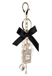 Creative Handmade Diy Diamond Perfume Bottle Accessories Alloy Bow Pearl Luxury Keychain Purses Charm Pendant YS0686670910