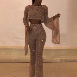 Sexy Hollow Backless Long sleeved jumpsuit Elegant Women's O-neck Party Pajamas 2024 Fashionable Shining Sequins Ultra thin Club jumpsuit 231227