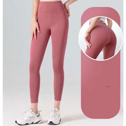 "Women's Quick Dry Peach Fitness Yoga Pants - High Waist, Hip-Lifting, Trackless Long Tights for Running, Exercise, and Yoga"