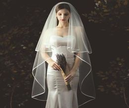 Elegant Bridal Veils Bride Veil Fingertip Length TwoLayer Simple Handmade Noble Tulle Ribbon Edge Wedding Veil Headwear Comb8891418