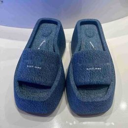 slippers for women with thick soles and one line outer wear. 2023 summer sponge cake soles elevated beach shoes lazy people's sandals