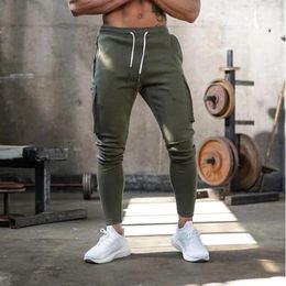 Pants Autumn Winter Fashion New HighQuality Men's Sports Gyms Fitness Camouflage Jogging Pants Outdoor Leisure Large Pocket Pants